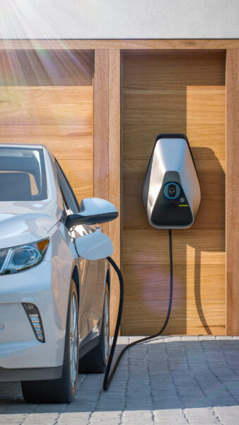 electric vehicle of the future using smart electric car charging station at home frontal perspective