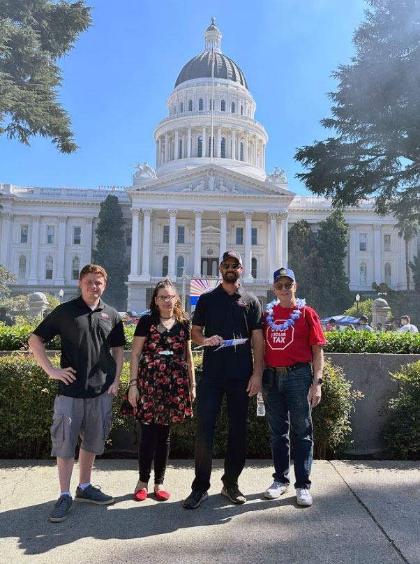 ACR Solar team members posing in front of the capital building.